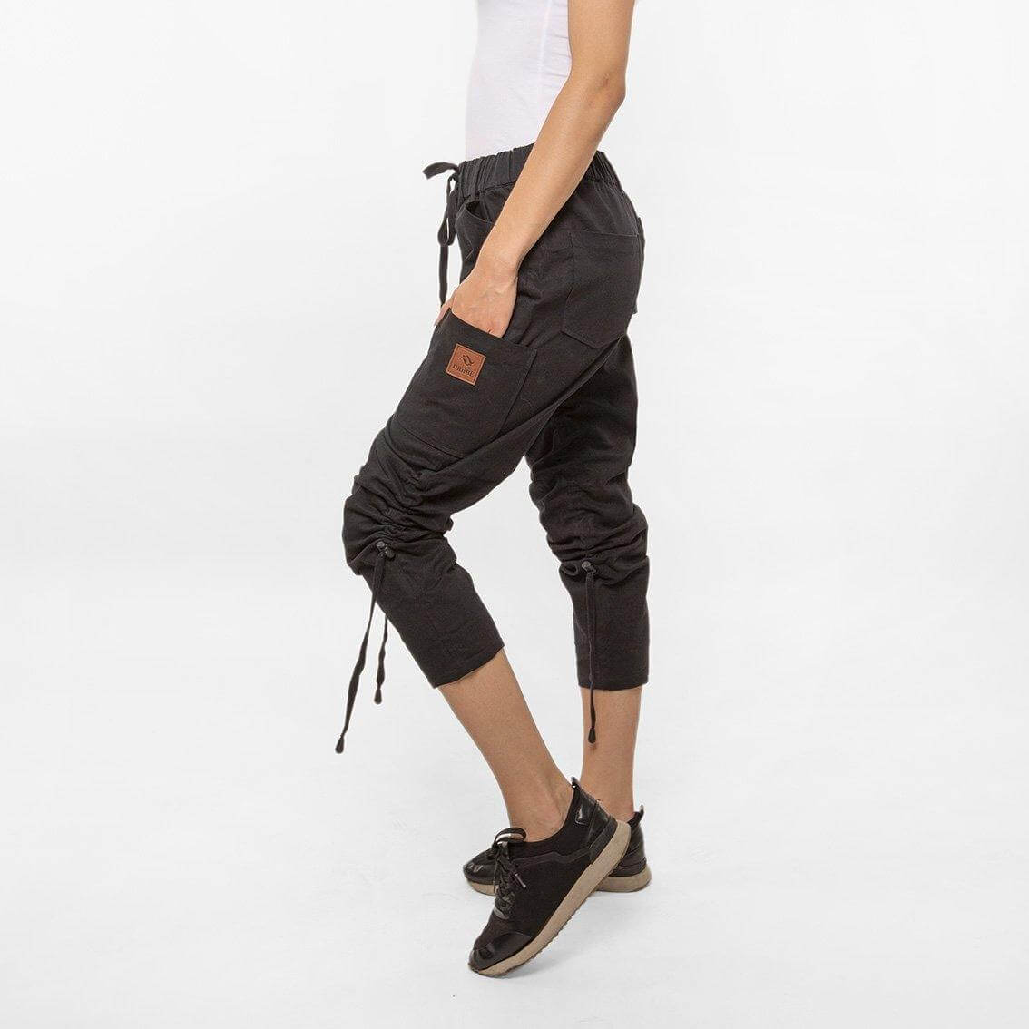A pair of DownUNDERS Women's Travel Pants showcasing their versatile design and multiple pockets, perfect for travel.
