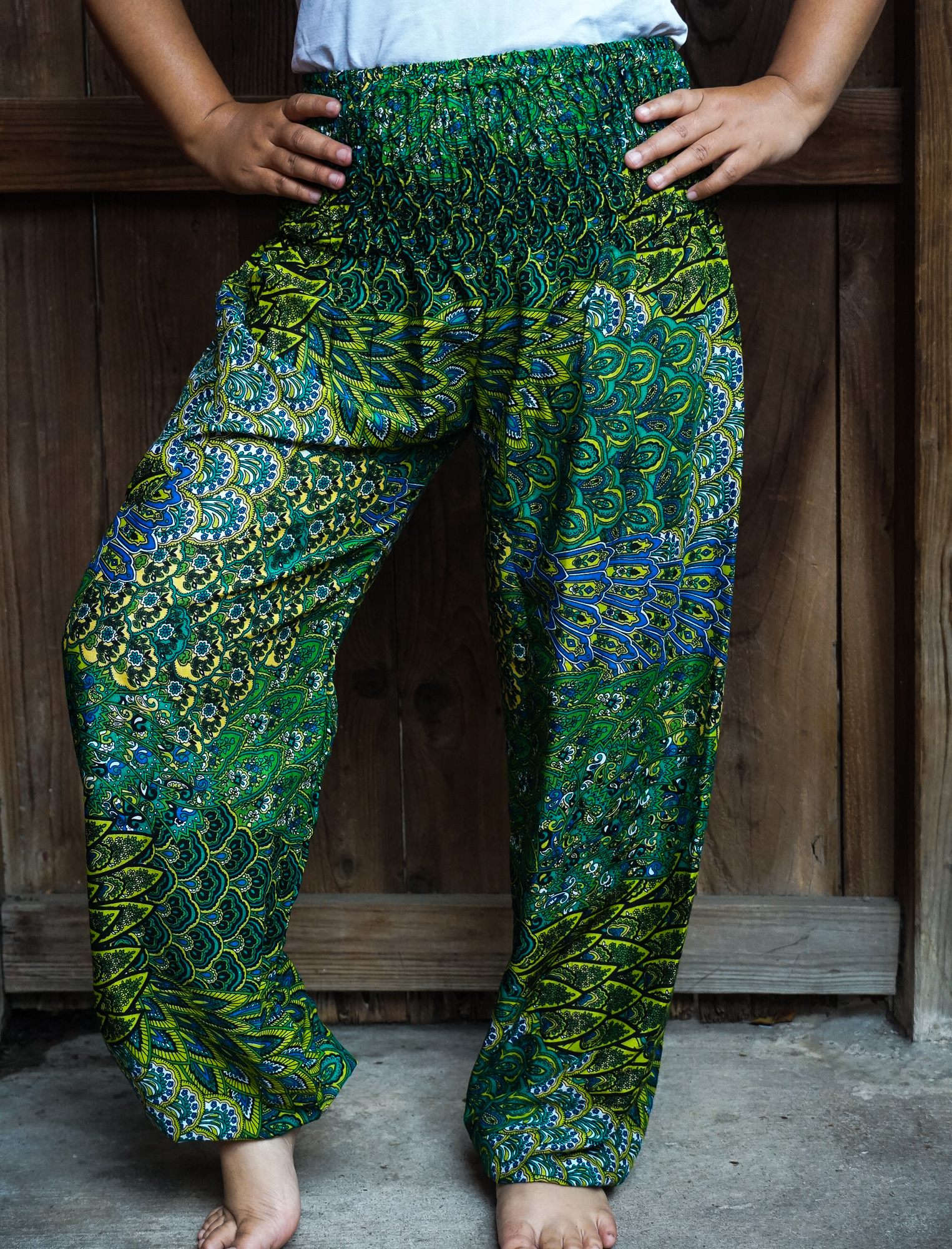 New Green Peacock Boho Hippie Gypsy Pants showcasing vibrant peacock pattern and elastic waist design, perfect for casual and active wear.