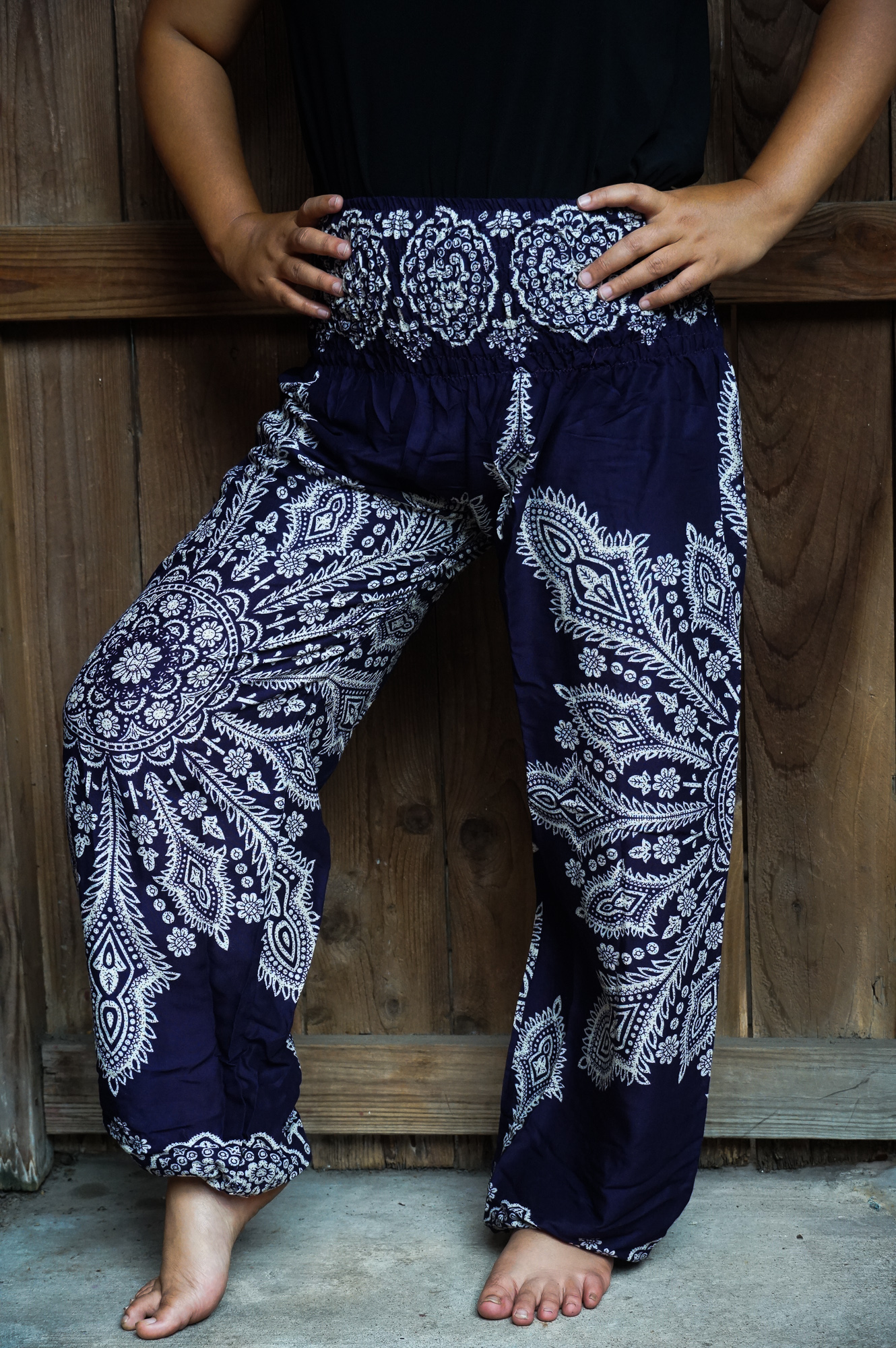 Purple Butterfly Harem Pants made of lightweight rayon, featuring an elastic waist and ankle, perfect for casual and active wear.