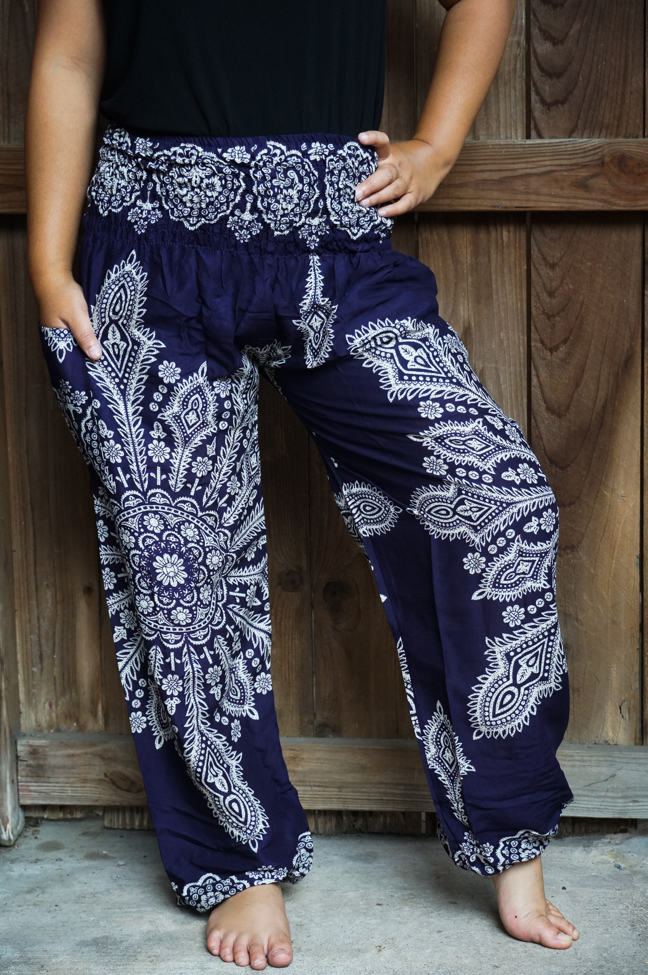 Purple Butterfly Harem Pants made of lightweight rayon, featuring an elastic waist and ankle, perfect for casual and active wear.