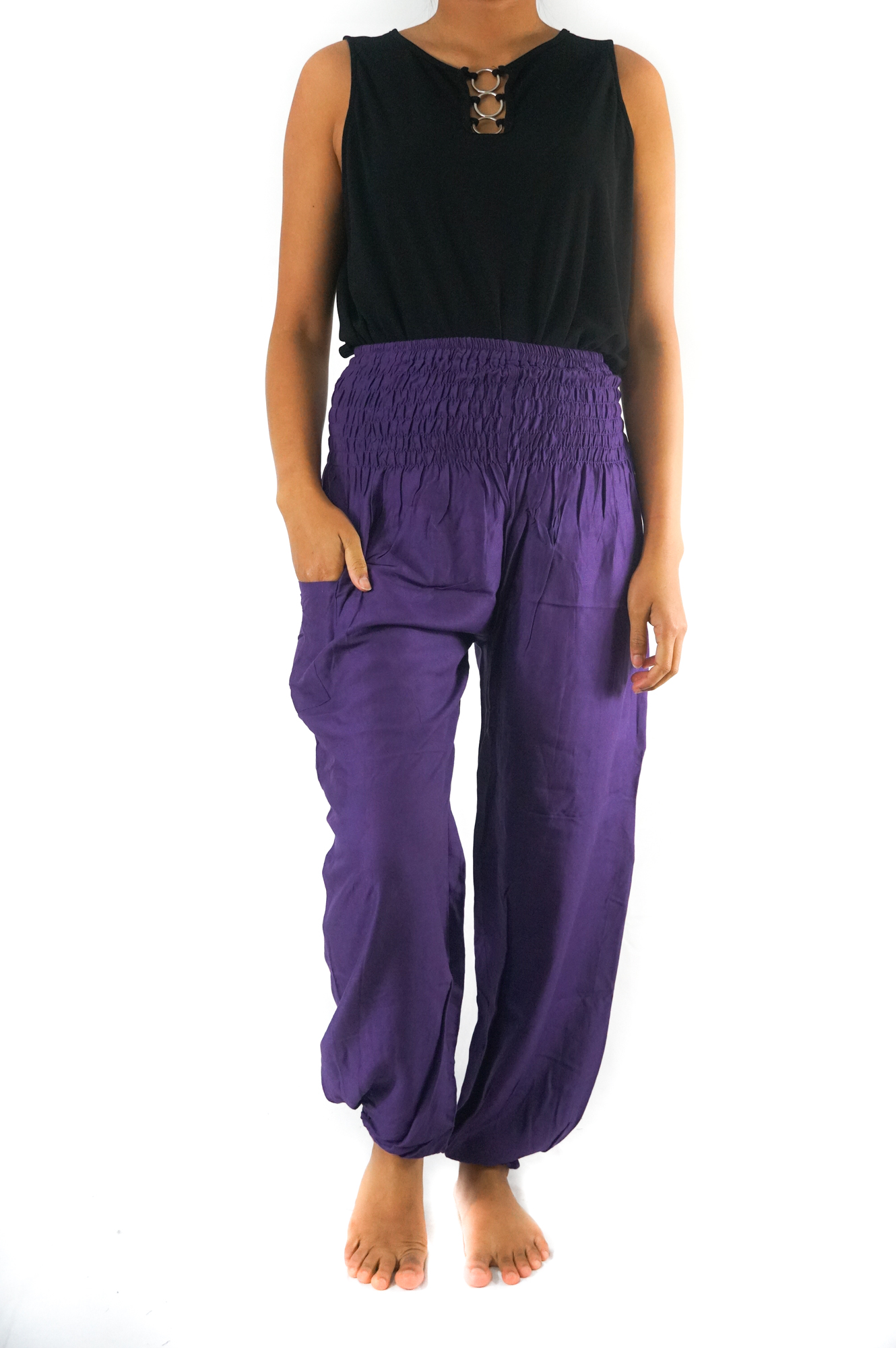 A pair of vibrant purple women boho harem pants made from lightweight rayon, featuring an elastic waist and ankle, with a side pocket, perfect for yoga and casual wear.