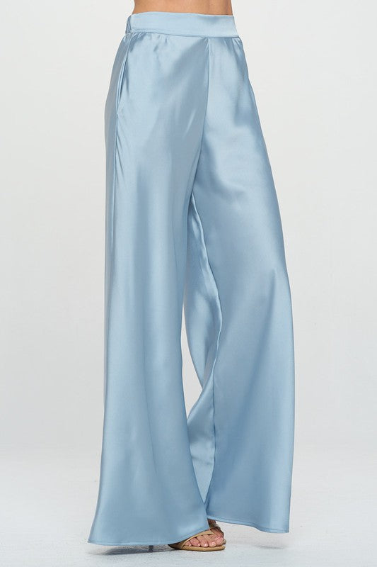 A pair of stylish stretch satin pants featuring an elastic waist and pockets, perfect for casual or formal wear.