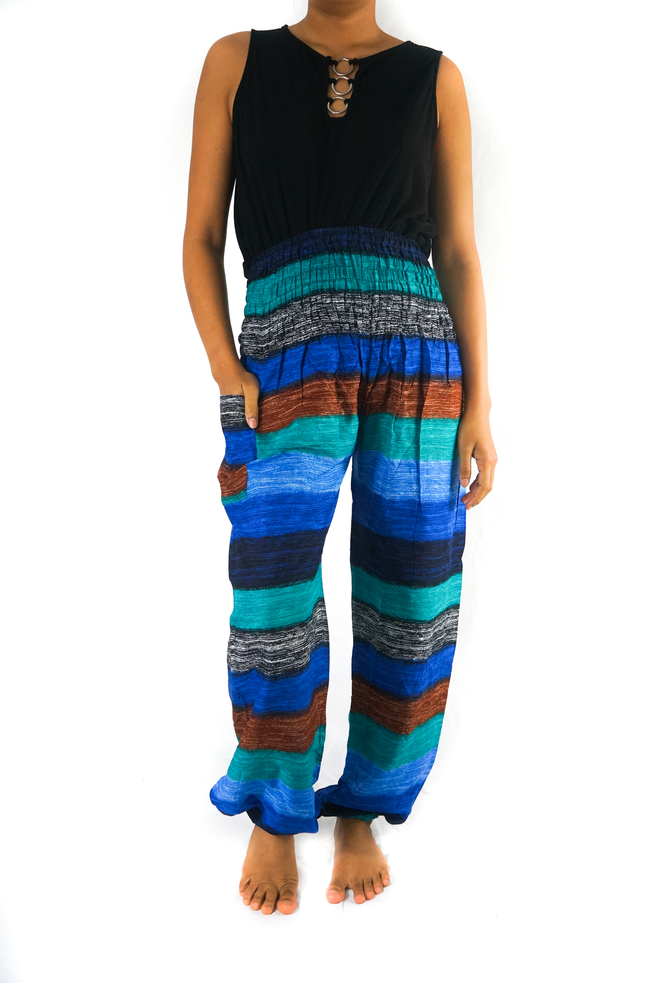 A pair of colorful Stripe Boho Pants made from lightweight rayon, featuring an elastic waist and ankle, with a side pocket, perfect for yoga and casual wear.