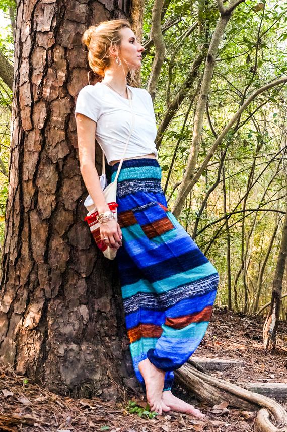 A pair of colorful Stripe Boho Pants made from lightweight rayon, featuring an elastic waist and ankle, with a side pocket, perfect for yoga and casual wear.