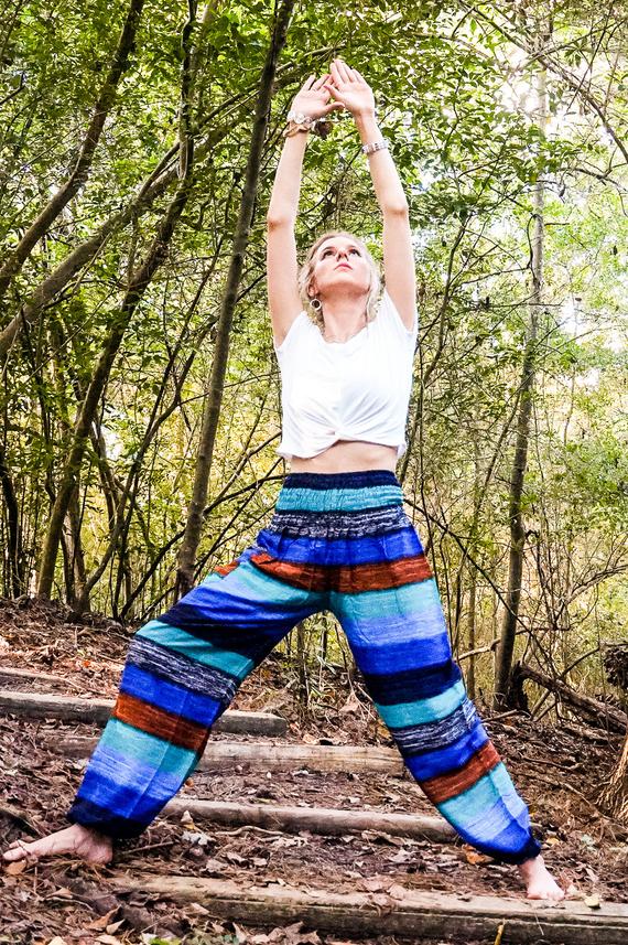 A pair of colorful Stripe Boho Pants made from lightweight rayon, featuring an elastic waist and ankle, with a side pocket, perfect for yoga and casual wear.
