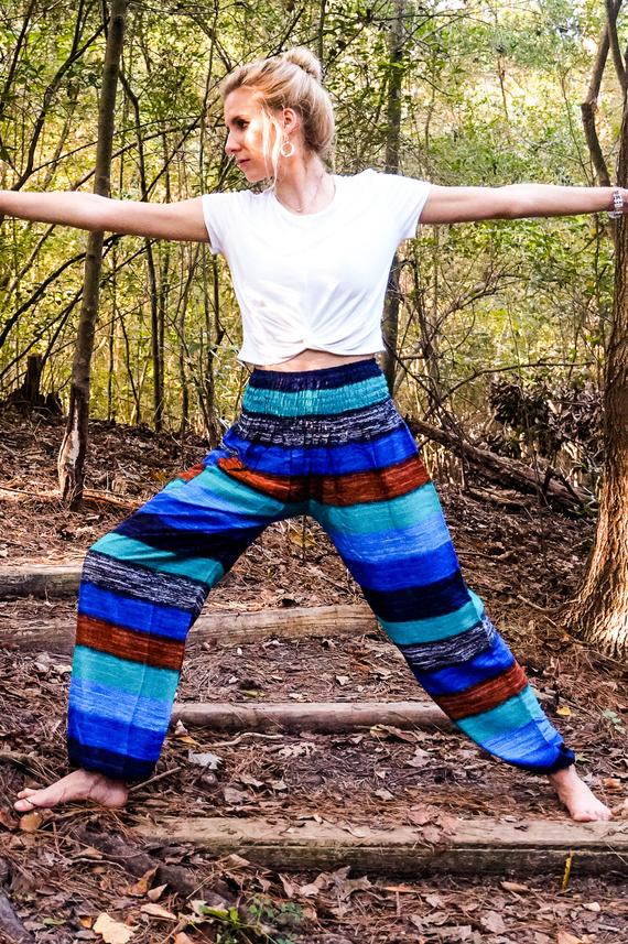 A pair of colorful Stripe Boho Pants made from lightweight rayon, featuring an elastic waist and ankle, with a side pocket, perfect for yoga and casual wear.