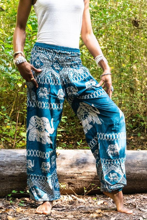 Teal Elephant Harem Pants for women, featuring a vibrant elephant pattern, elastic waist, and side pocket, made from breathable rayon fabric.