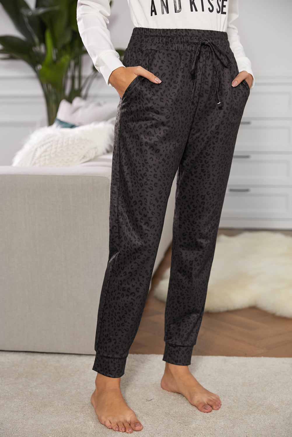 Women Casual Black Breezy Leopard Joggers featuring a stylish leopard print and adjustable smocked waist, perfect for casual wear.