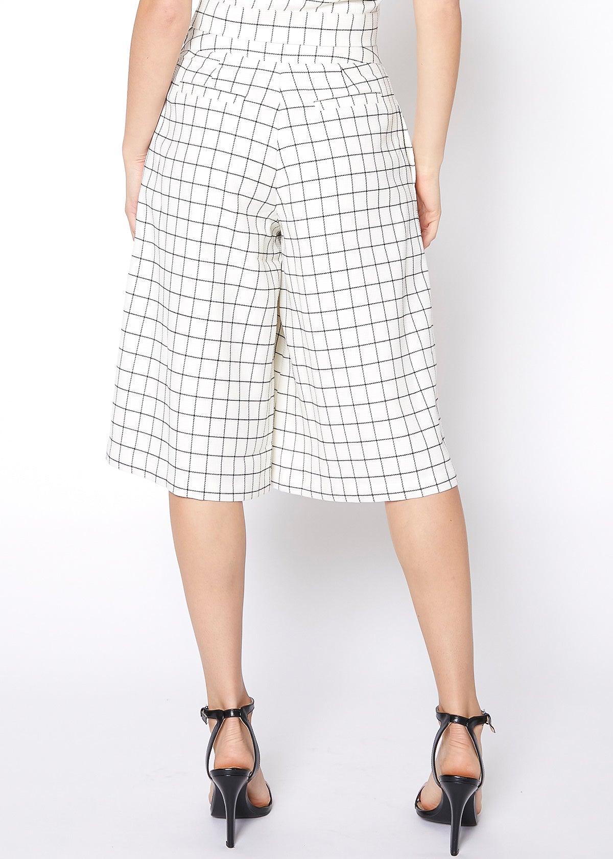 A pair of women's wide leg pants in square jacquard pattern, featuring pleated inseam and hidden side pockets.