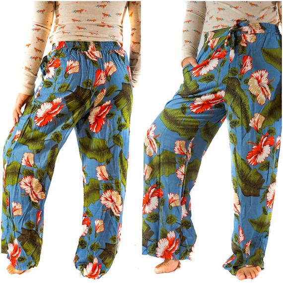 A pair of women's XS-M leaf print pants made from lightweight rayon, featuring a drawstring waist and two side pockets, perfect for boho-chic style.