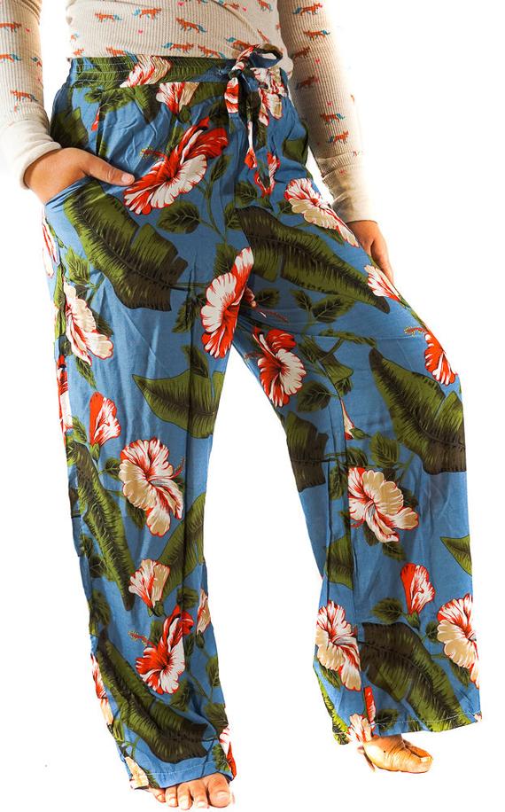 A pair of women's XS-M leaf print pants made from lightweight rayon, featuring a drawstring waist and two side pockets, perfect for boho-chic style.