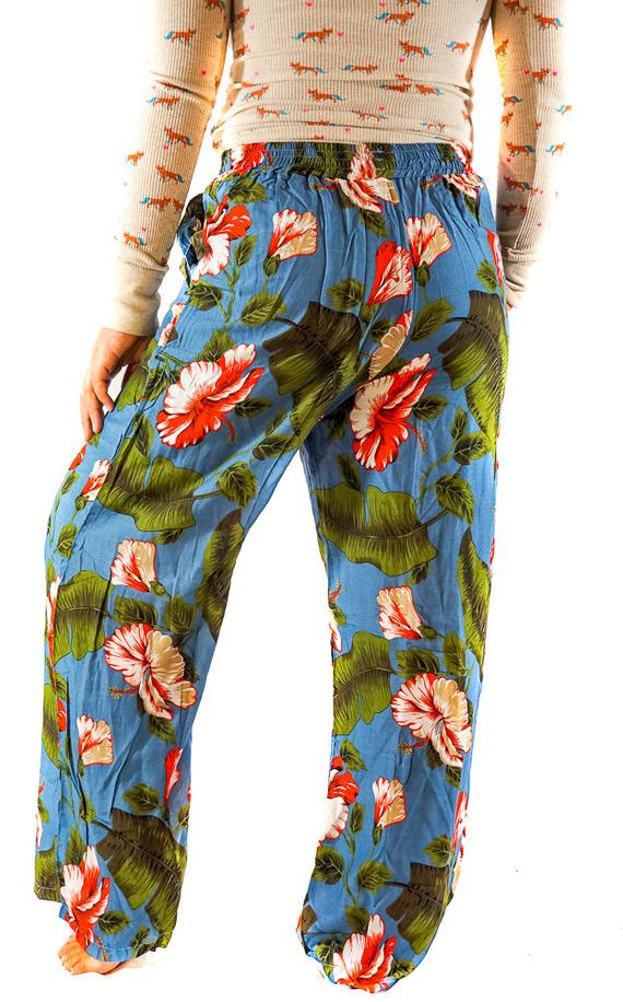 A pair of women's XS-M leaf print pants made from lightweight rayon, featuring a drawstring waist and two side pockets, perfect for boho-chic style.
