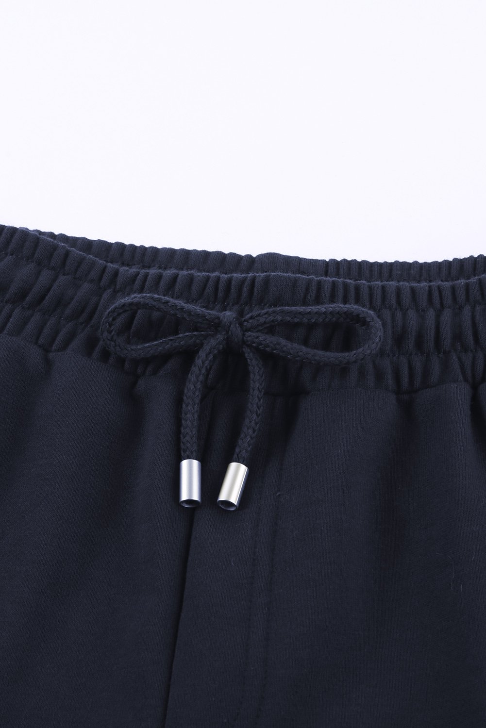 A pair of navy blue women's lounge shorts featuring a tie waist, cuffed hem, and side pockets, perfect for summer wear.