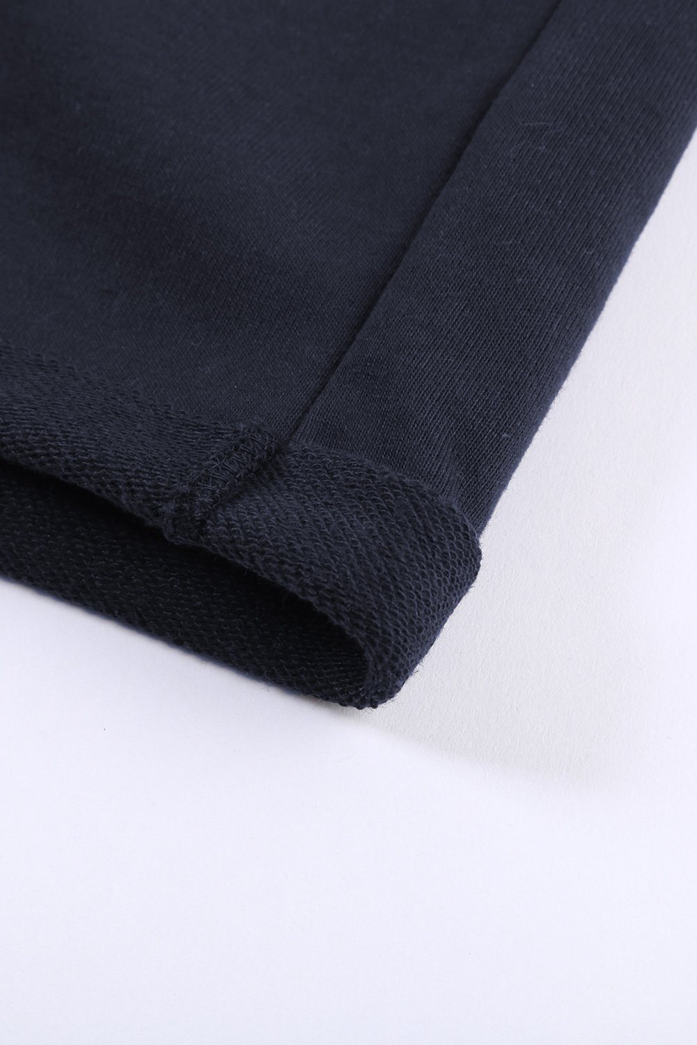 A pair of navy blue women's lounge shorts featuring a tie waist, cuffed hem, and side pockets, perfect for summer wear.