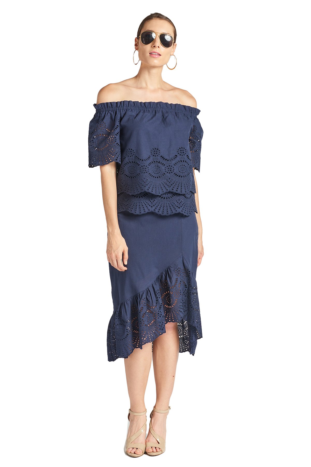 Aster Skirt in navy featuring cotton eyelet fabric, asymmetric hi-lo design, and scalloped ruffle hem, perfect for summer outings.