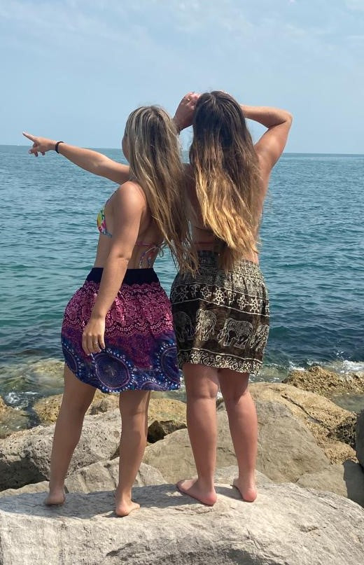 Bohotusk Olive Green Amboseli Elephant Print Short Skirt displayed on a mannequin, showcasing its stylish design and comfortable fit.