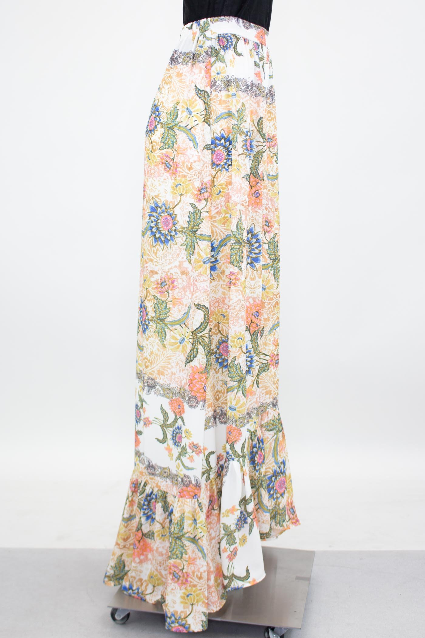 A stylish flared bottom floral maxi skirt featuring a vibrant floral print and an elastic waistband, perfect for casual and semi-formal occasions.