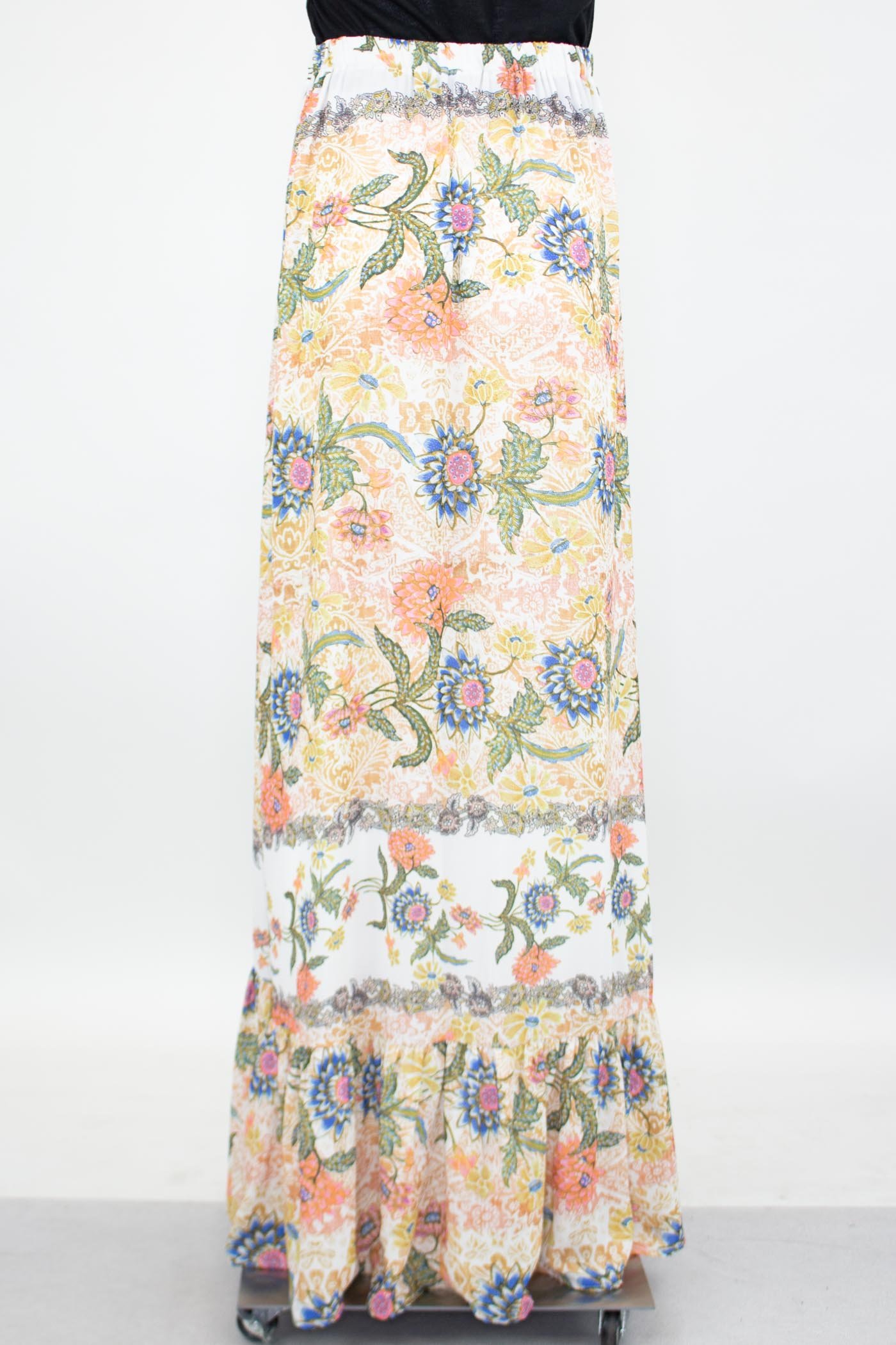 A stylish flared bottom floral maxi skirt featuring a vibrant floral print and an elastic waistband, perfect for casual and semi-formal occasions.