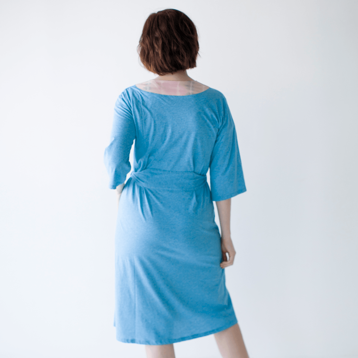 PIMA Short Robe made from soft, organic cotton, showcasing its elegant design and comfortable fit.