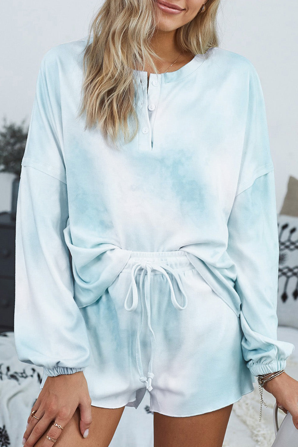 Sky Blue Tie Dye Knit Pajamas Set featuring a long sleeve top and shorts with a chic tie dye pattern and ruffle hemline.