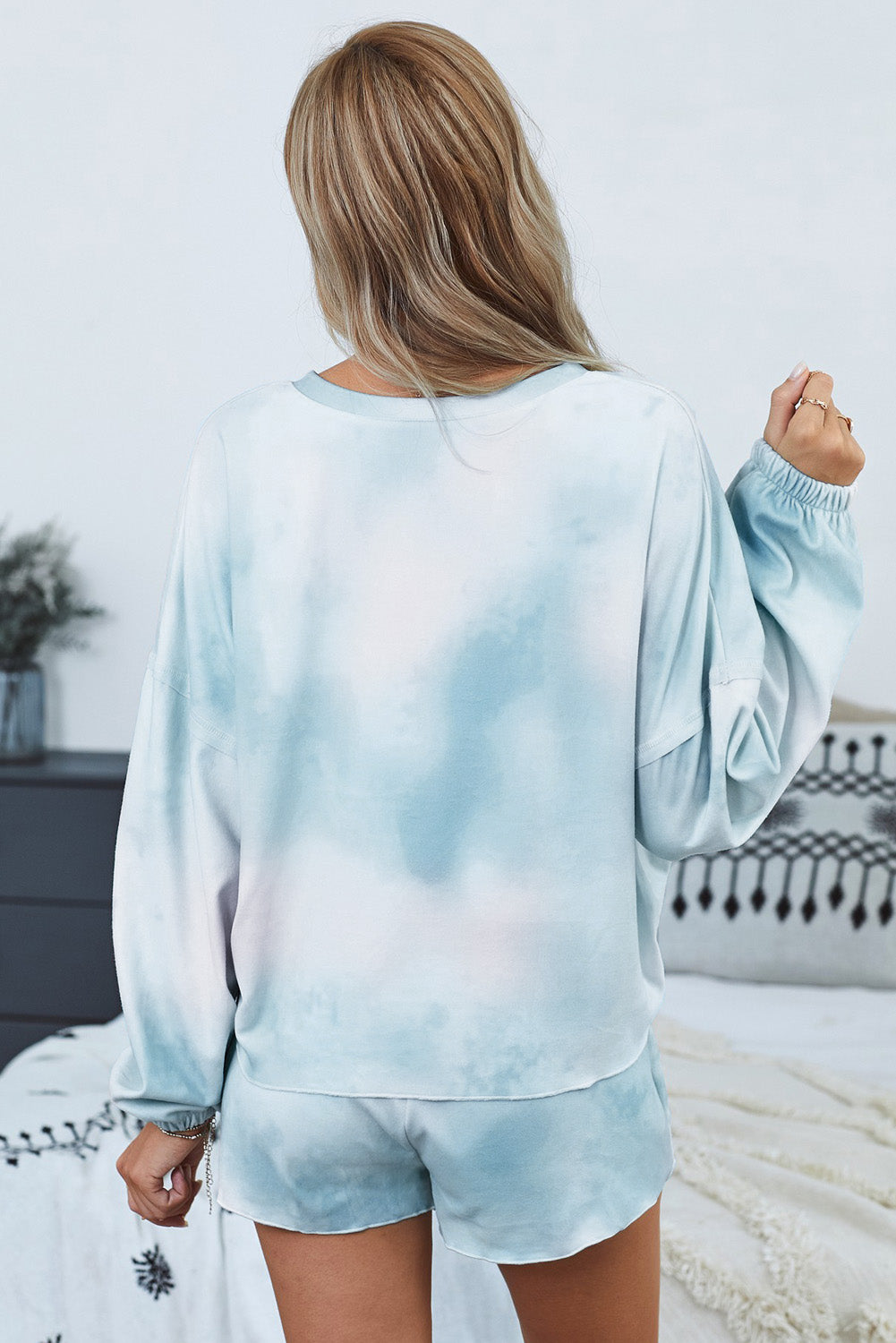 Sky Blue Tie Dye Knit Pajamas Set featuring a long sleeve top and shorts with a chic tie dye pattern and ruffle hemline.