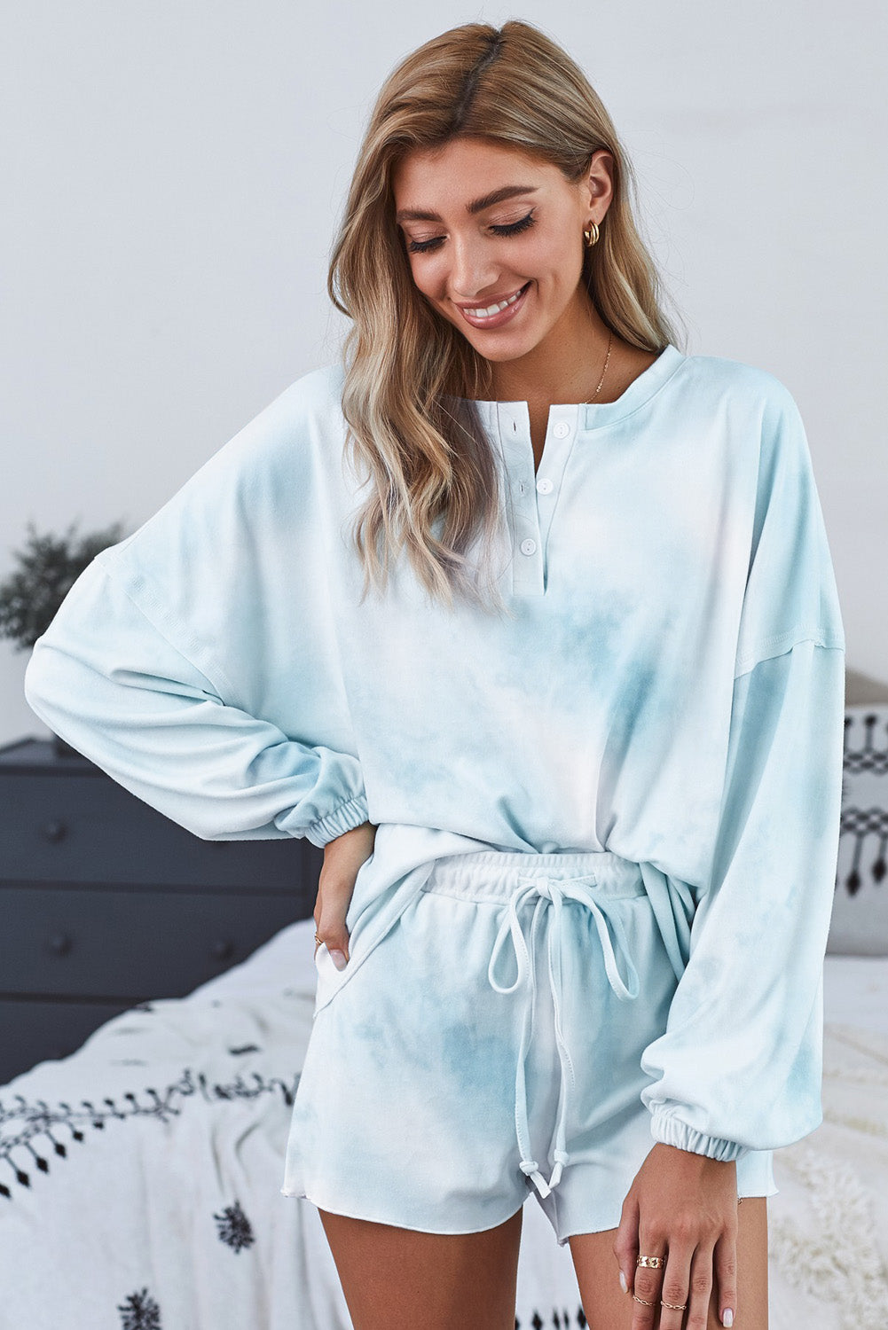Sky Blue Tie Dye Knit Pajamas Set featuring a long sleeve top and shorts with a chic tie dye pattern and ruffle hemline.