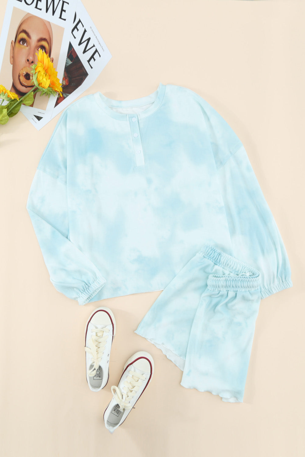Sky Blue Tie Dye Knit Pajamas Set featuring a long sleeve top and shorts with a chic tie dye pattern and ruffle hemline.