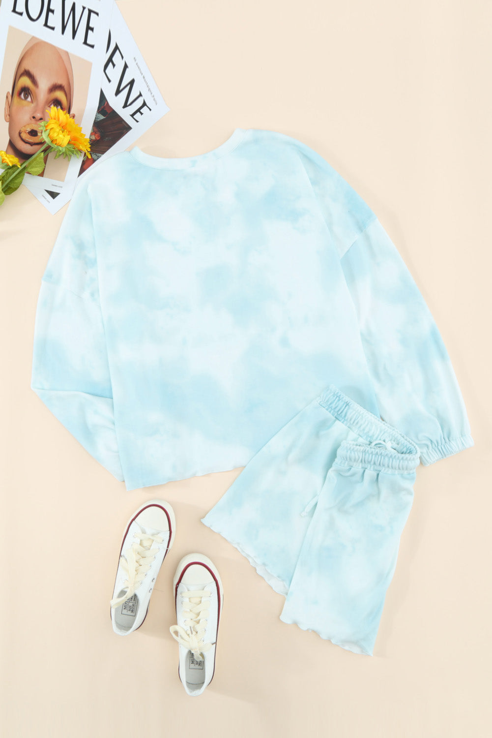 Sky Blue Tie Dye Knit Pajamas Set featuring a long sleeve top and shorts with a chic tie dye pattern and ruffle hemline.