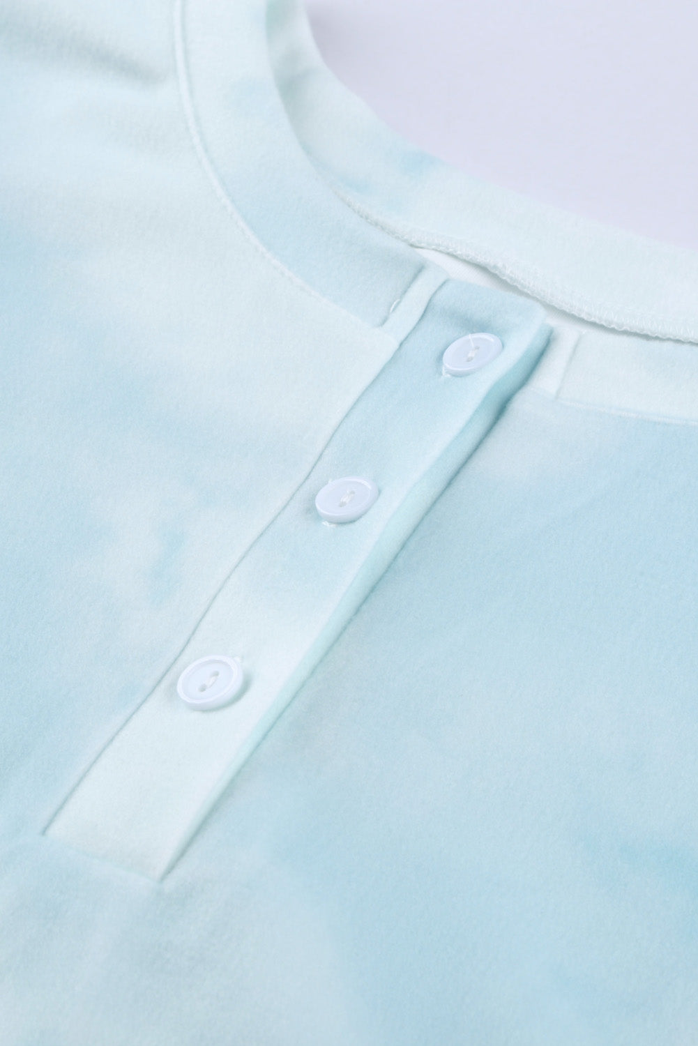 Sky Blue Tie Dye Knit Pajamas Set featuring a long sleeve top and shorts with a chic tie dye pattern and ruffle hemline.