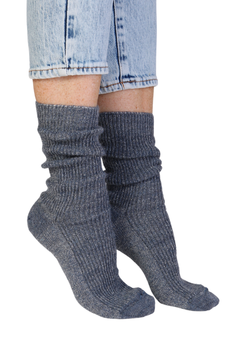 A pair of blue glittery socks made from alpaca wool, showcasing their soft texture and stylish design.