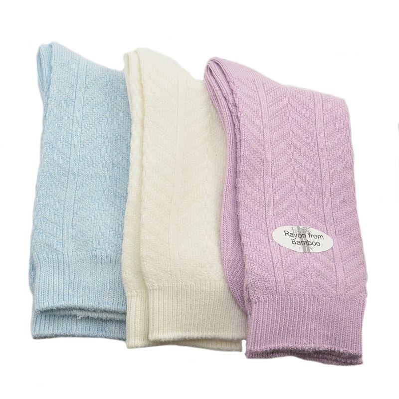 A pack of three pairs of medium weight bamboo crew socks featuring a stylish chevron pattern, showcasing their soft texture and comfortable fit.