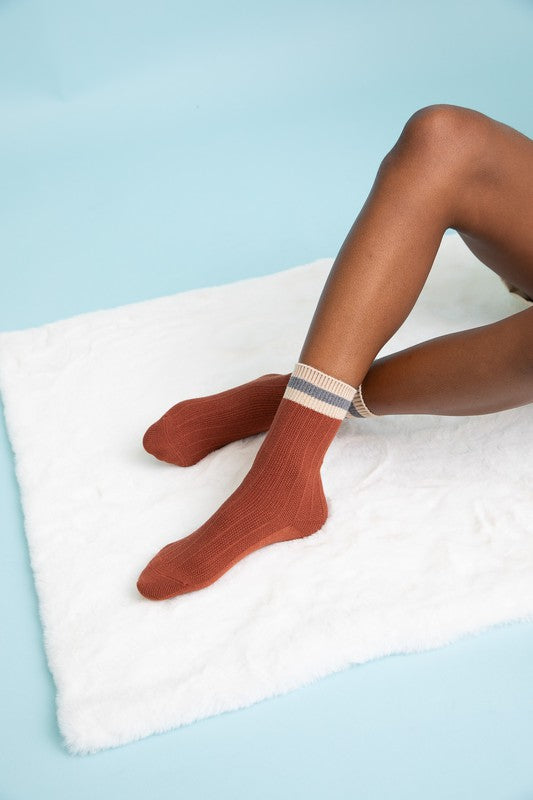 A pair of vibrant color block socks showcasing a mix of colors and patterns, made from a comfortable blend of materials.