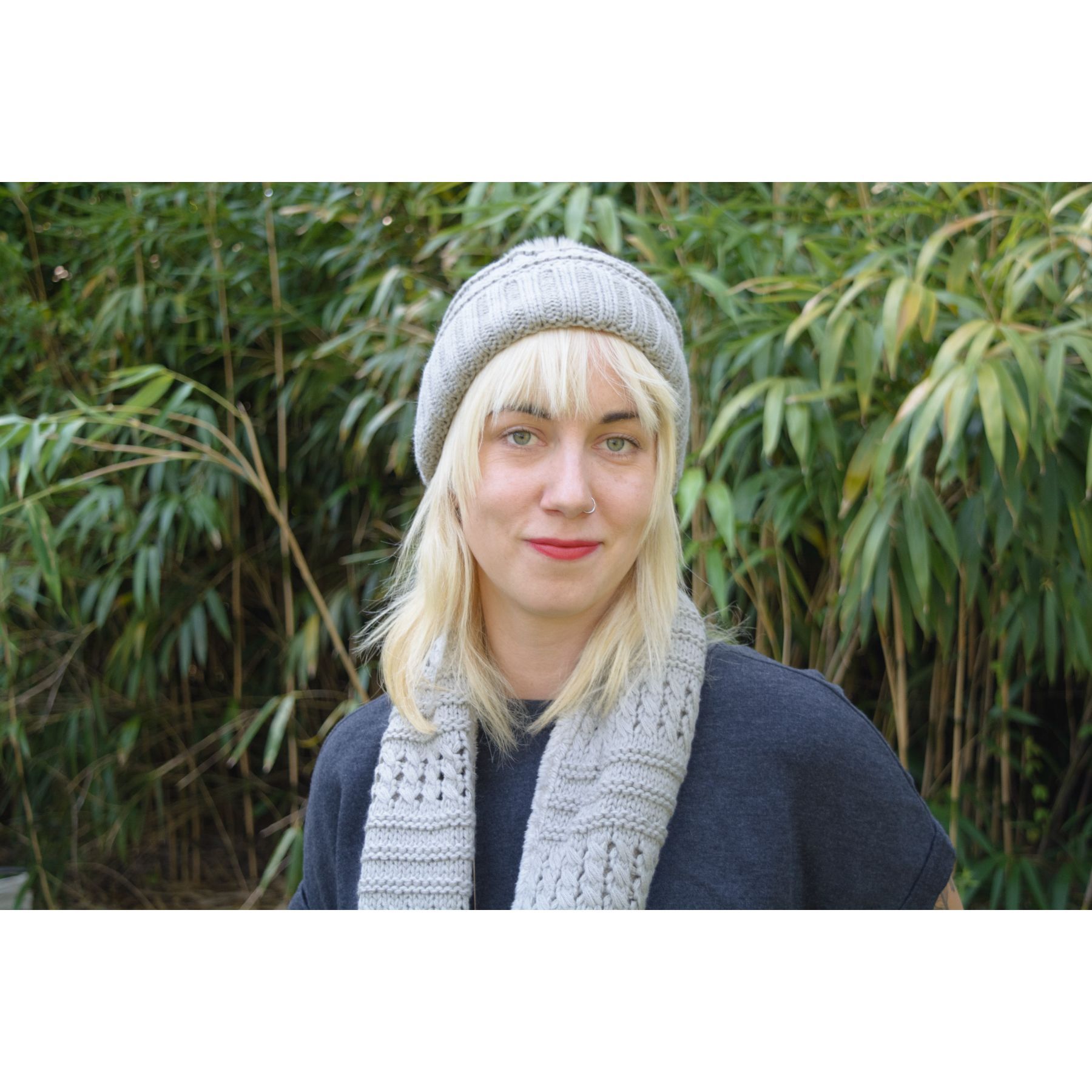 Fuzzy fur lined beanie with pom pom and matching scarf set in various colors, perfect for winter wear.