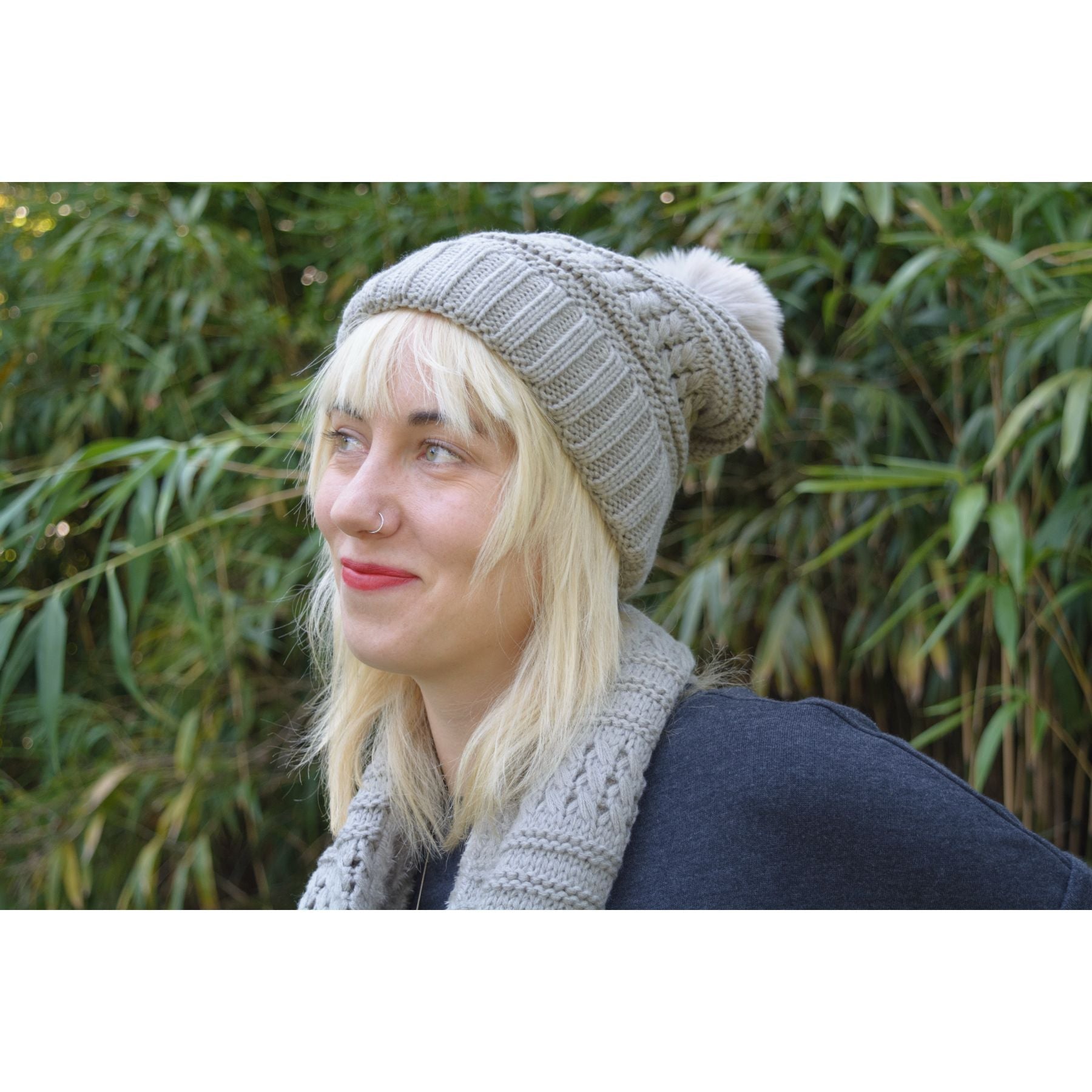 Fuzzy fur lined beanie with pom pom and matching scarf set in various colors, perfect for winter wear.