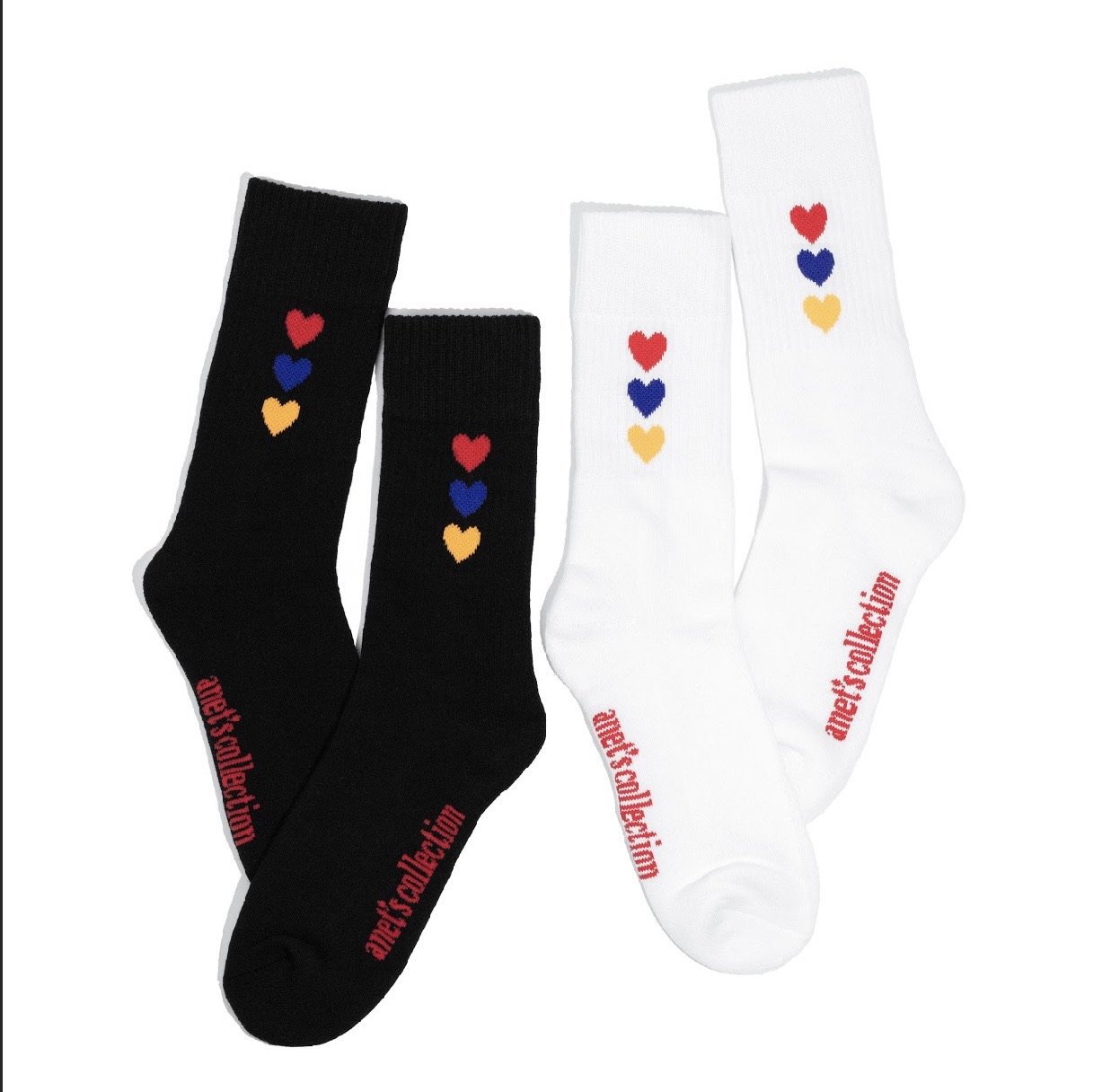 Hearts of Armenia Socks featuring jacquard design with red, orange, and blue hearts on a black and white background.