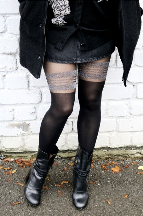 A pair of MINELLI black sparkling tights for women, showcasing a shimmering design and elegant texture, perfect for various occasions.