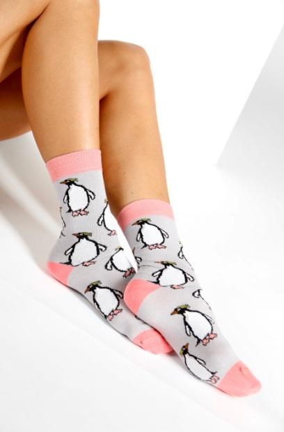 A pair of PINGU cotton socks featuring a playful penguin pattern, suitable for both men and women.