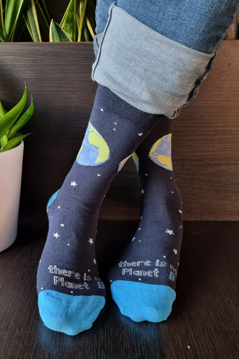 PLANET B blue cotton socks featuring a globe and stars design, made from recycled yarn, with the phrase 'THERE IS NO PLANET B'.
