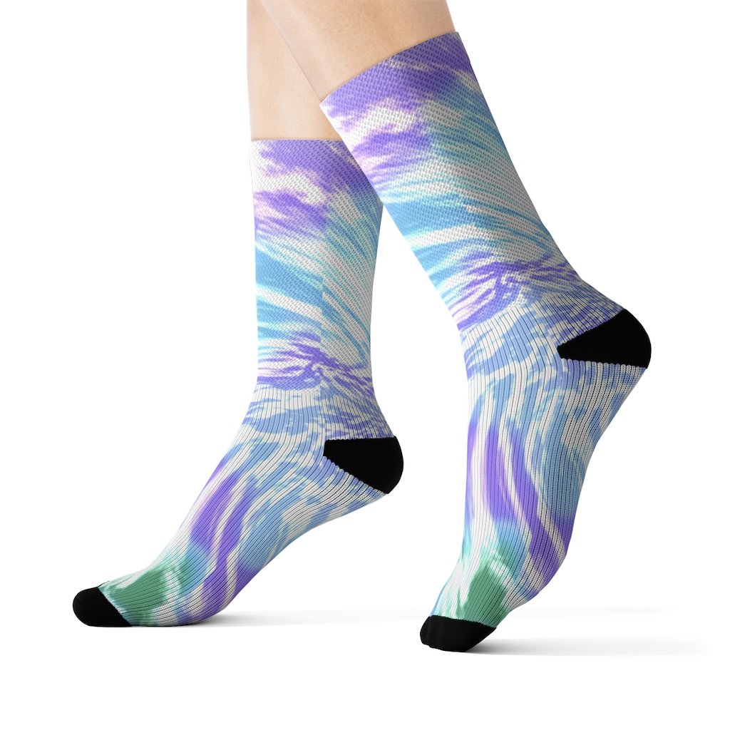 A pair of vibrant purple tie dye novelty socks displayed on a white background, showcasing their unique pattern and quality fabric.