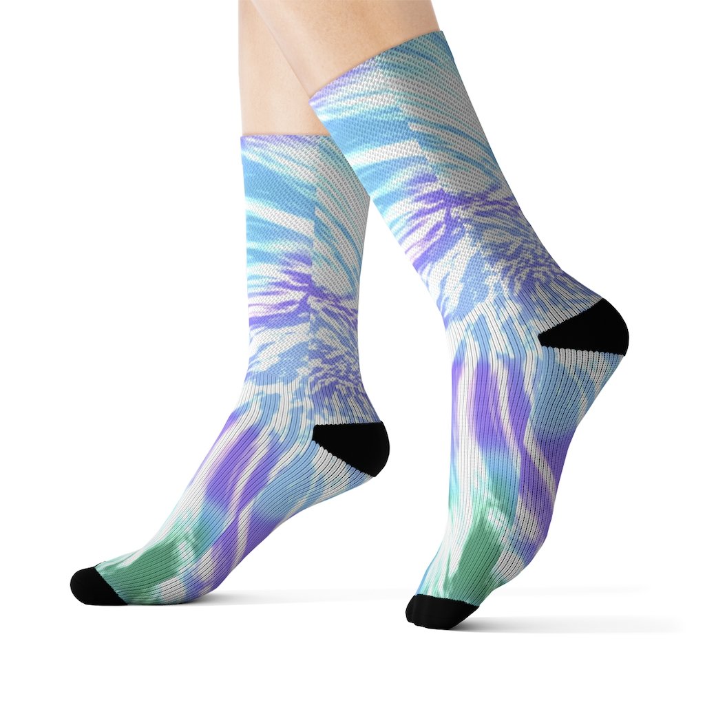 A pair of vibrant purple tie dye novelty socks displayed on a white background, showcasing their unique pattern and quality fabric.