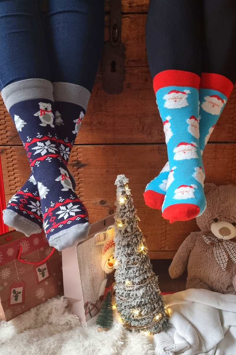 A pair of blue cotton socks featuring a cute Santa Claus design with a soft beard, perfect for the holiday season.