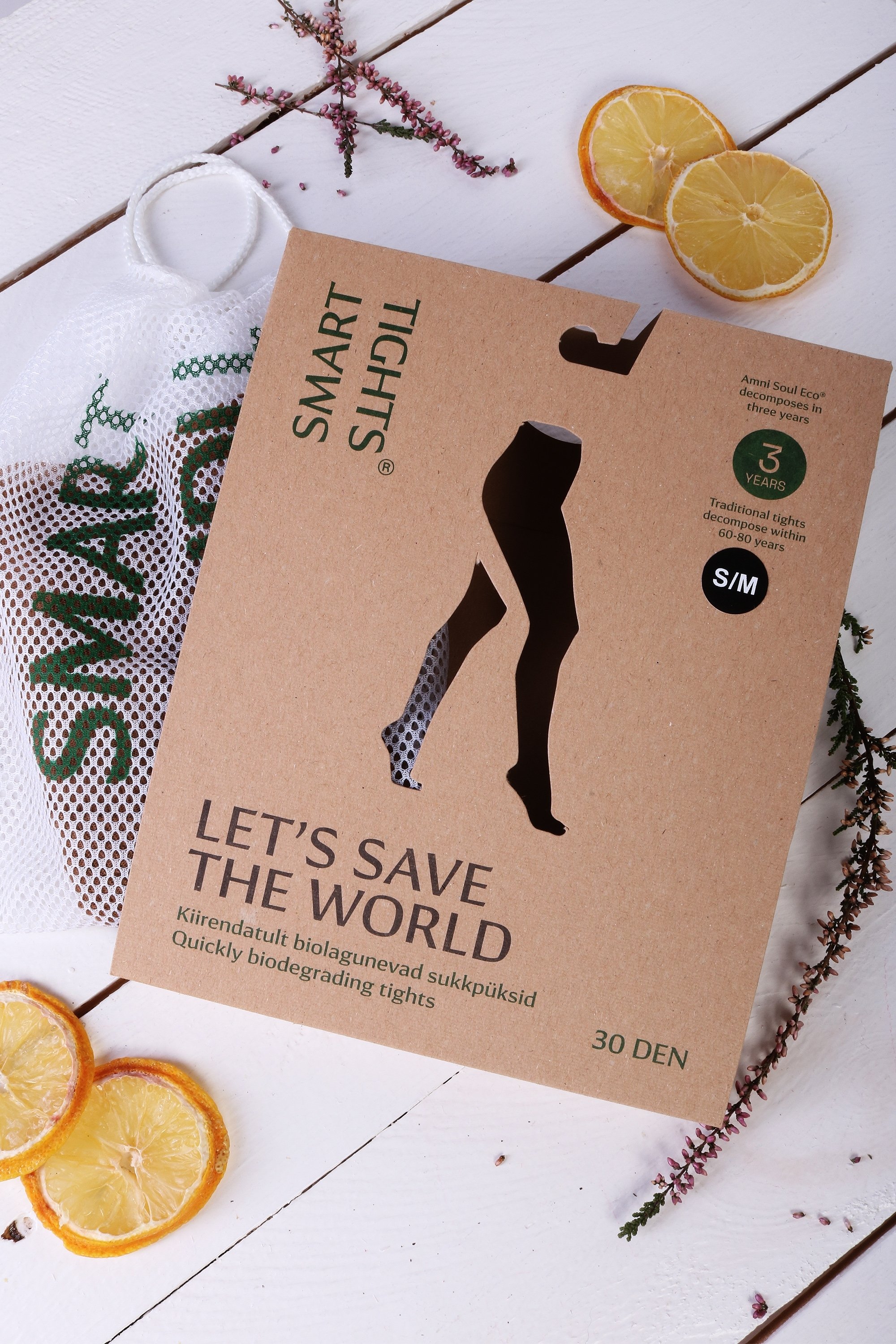 A pair of black 30 DEN SMART TIGHTS made from biodegradable yarn, showcasing their eco-friendly design and OEKO-TEX® certification.