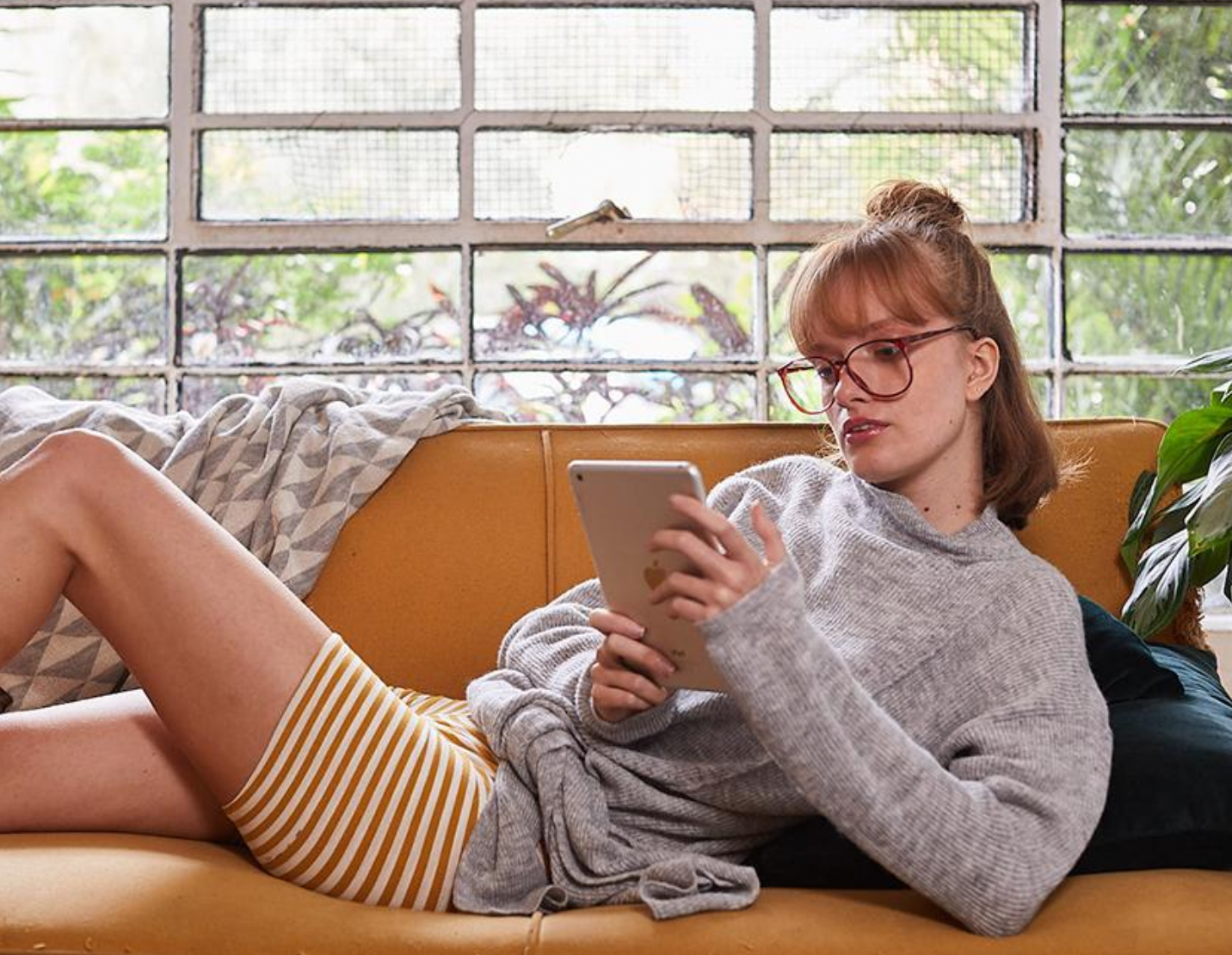 Front view of a stylish Alpaca Turtleneck Sweater with a front tie, available in Grey and Black, showcasing its oversized fit and luxurious texture.