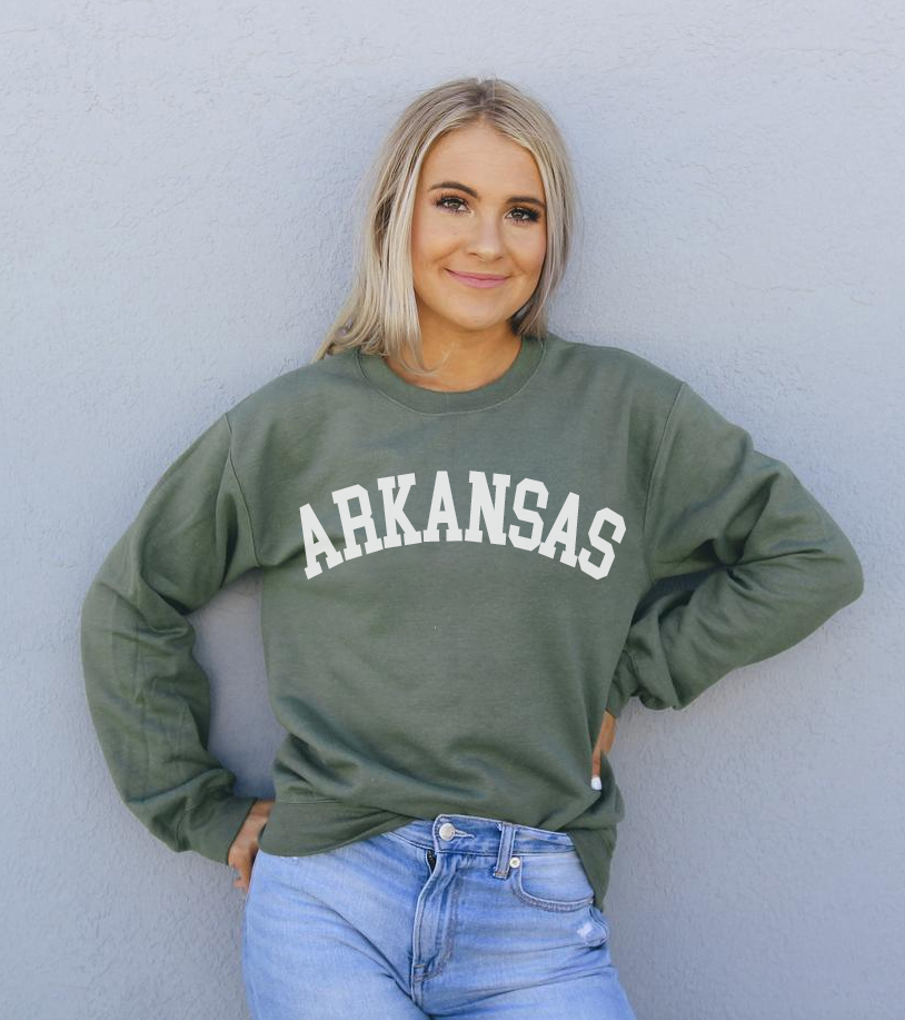 A cozy Arkansas Sweatshirt featuring a crew neck and rib-knit collar, made from soft air-jet spun yarn in a stylish unisex design.