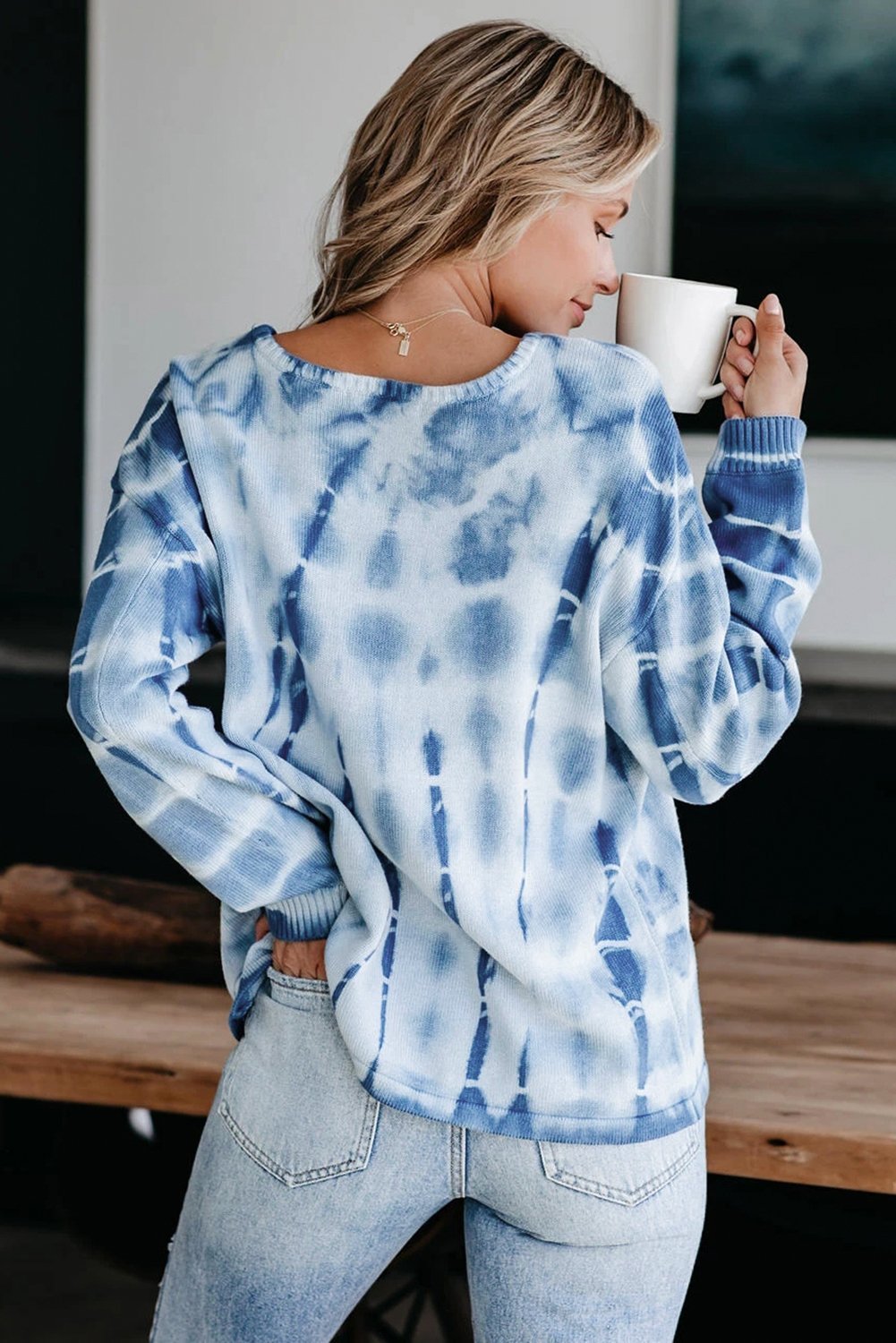 Blue and white tie-dye print knit sweater with a relaxed fit, showcasing full sleeves and a cozy chunky knit texture.