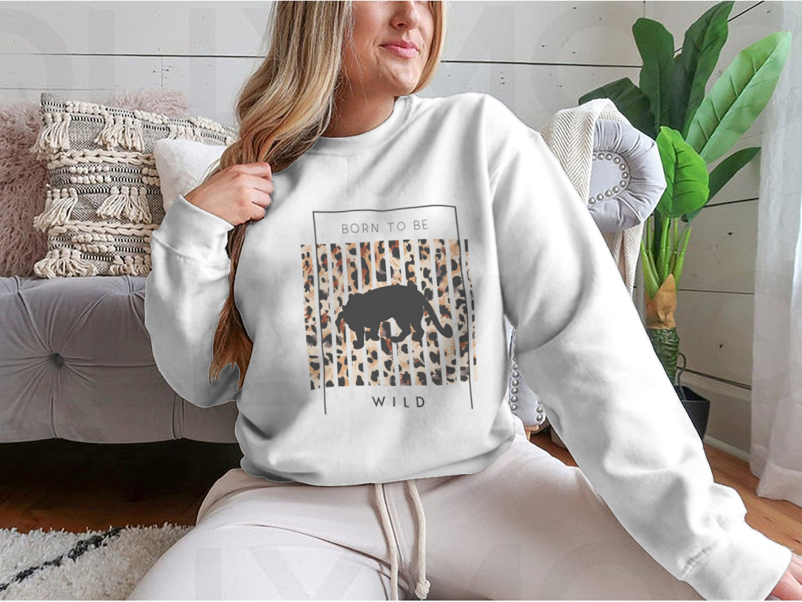 Born To Be Wild T-shirt featuring a tiger silhouette on a leopard background, showcasing vibrant colors and a stylish design.