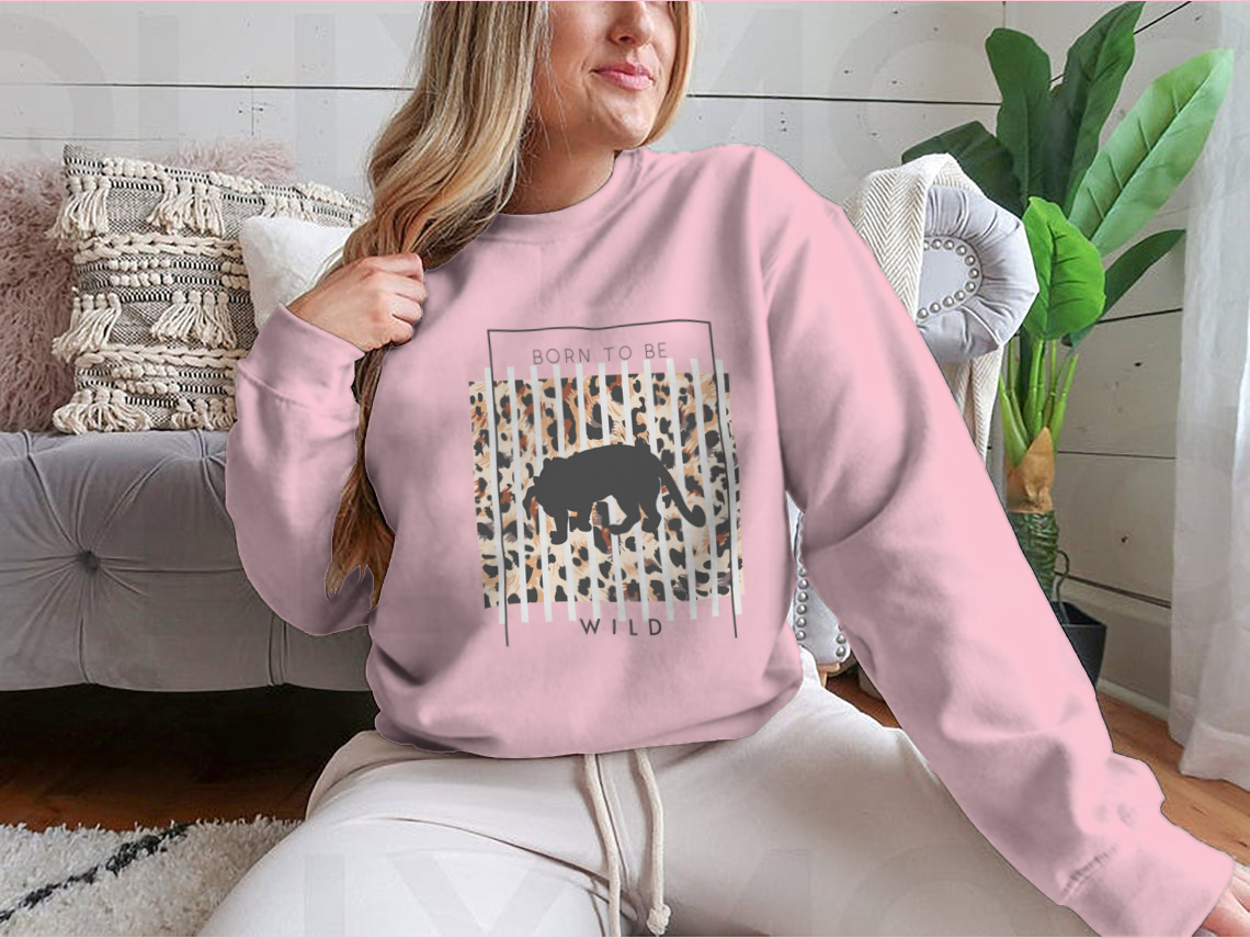 Born To Be Wild T-shirt featuring a tiger silhouette on a leopard background, showcasing vibrant colors and a stylish design.