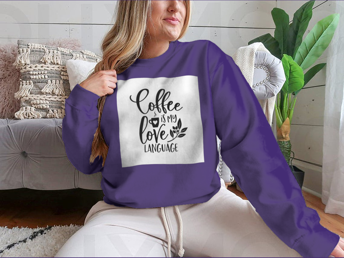 A humorous T-shirt featuring the slogan 'Coffee Is My Love Language' in stylish typography, made from soft cotton fabric.