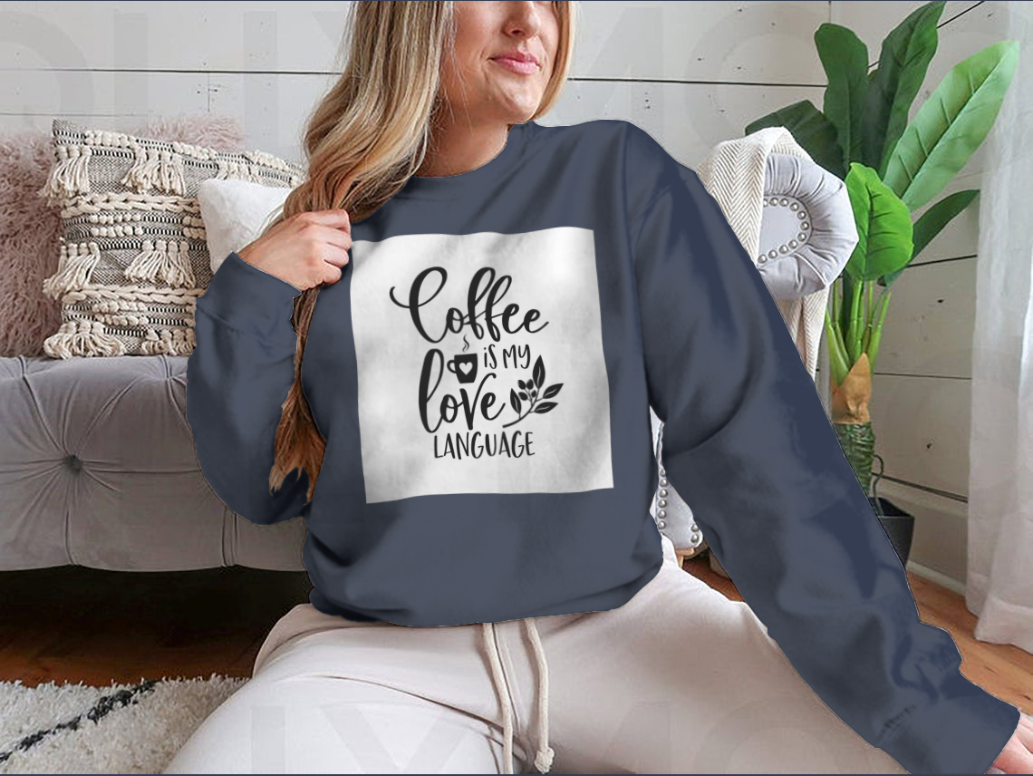 A humorous T-shirt featuring the slogan 'Coffee Is My Love Language' in stylish typography, made from soft cotton fabric.