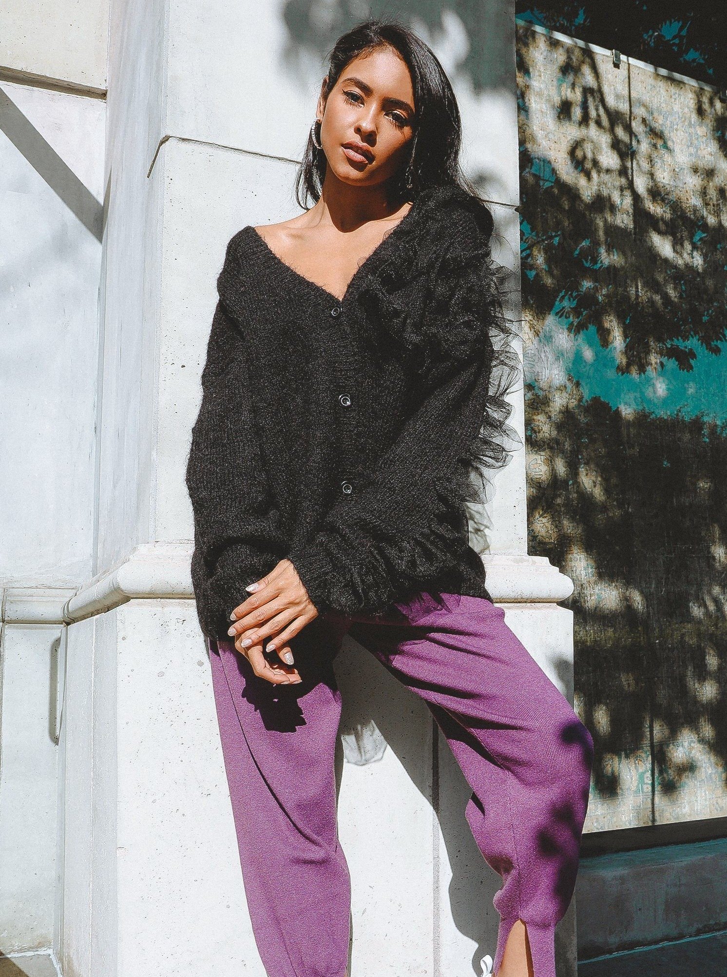 Collette Wool Blend Cardigan featuring ruffled organza sleeves and a v-neckline, styled casually.